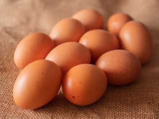 Brown Chicken Eggs on Burlap Texture