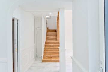 Light colored wooden staircase interior made from maple wood