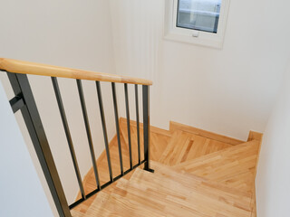 Light-colored wooden colored stairs that match a well-designed interior