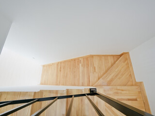 Light-colored wooden colored stairs that match well with the interior without harming the interior