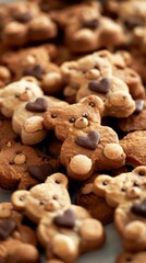 A close-up view showcasing a collection of cute bear-shaped chocolate chip cookies with some bears holding a chocolate heart