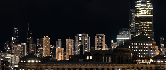 Chicago Downtown. Cityscape image of Chicago, Ill. USA  at night showing high rises  in the downtown district.