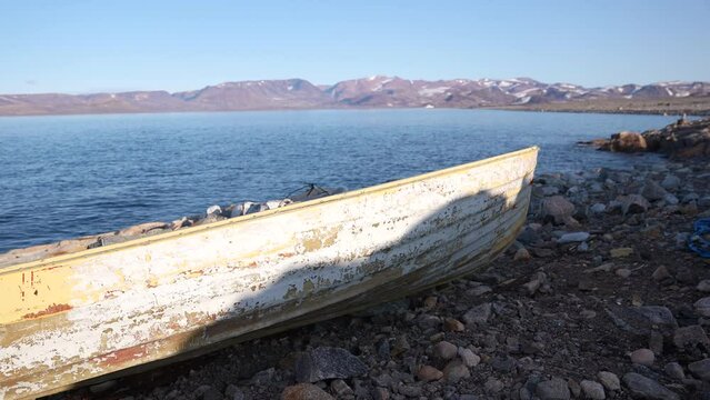 Rustic Boat on Coast of Cape Tobin, Greenland on Sunny Late Spring Day