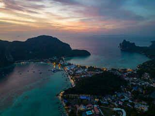 A stunning sunset over a small Phi Phi islands surrounded by sea and clouds