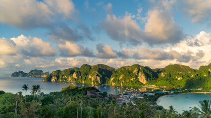 Tropical island Phi Phi with mountains, lake, and sky reflecting in the water