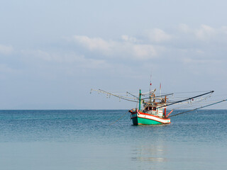 Fishing boat anchored against a clear sky. Sunny day. No people, outdoors. Concept of leisure and travel