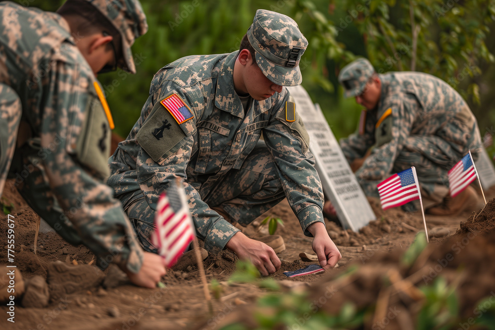 Poster three soldiers are kneeling in the dirt, placing american flags in the ground. the flags are arrange