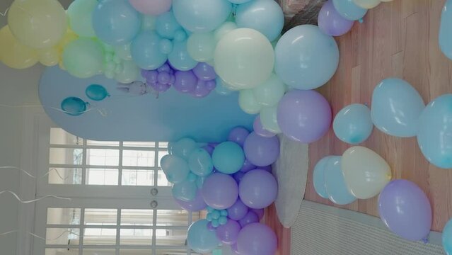 Baby shower decoration photo zone_vertical view. Baby shower party. Man and pregnant woman are expecting baby.