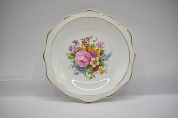 Vintage porcelain plates with floral designs