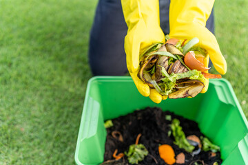 Ecology compost supply Kitchen waste recycling composter environmentally friendly. The young man...
