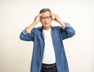 Handsome asian mature old man standing headache on isolated white background. Portrait of serious depressed senior asian man looking at camera. Mature People and lifestyle