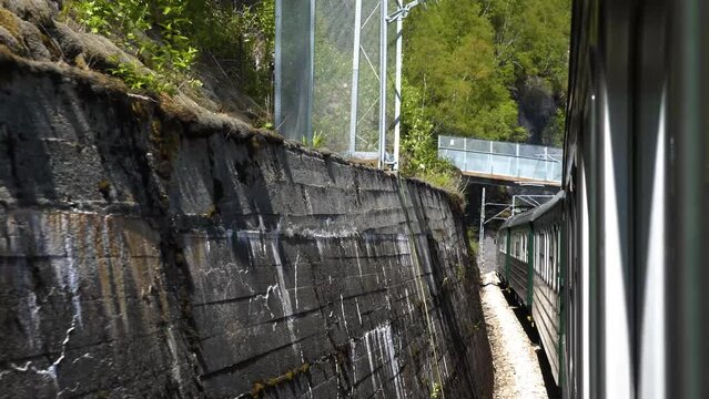 The train goes to the mountain gorge. Norway