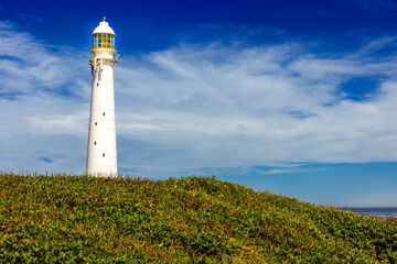 Fototapeta na wymiar Slangkop lighthouse on the coast of the sea