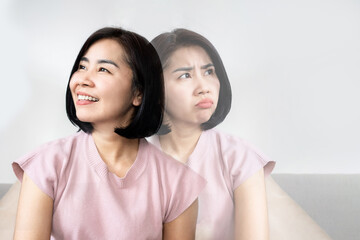 bipolar disorder concept with double personality Asian woman in difference emotional face angry and happy