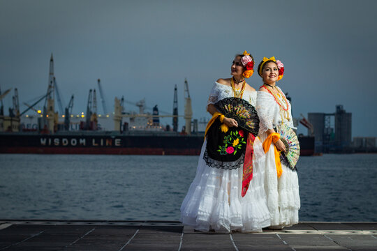 Dancers of traditional Veracruz music on the port's boardwalk.