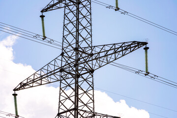 High voltage towers with sky background. Power line support with wires for electricity...