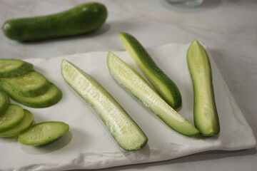 cut mini cucumber on a plate that's easy to eat