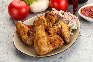Grilled chicken wings with sauce