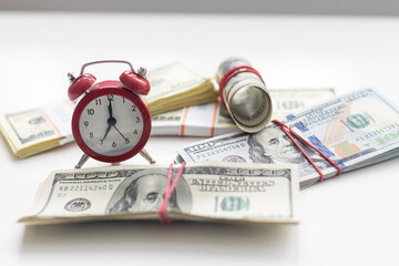 Time is money finance concept with old vintage clocks, dollar bills, spectacles and euro coins