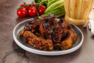 Grilled pork ribs in barbecue sauce