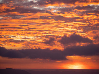 The sunset dyed clouds red.