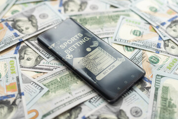 dollars and euros, smartphone with sports bet application