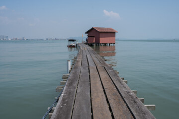 Chew Jetty on Penang in Malaysia is a place with wooden houses on wild constructions and piers in...