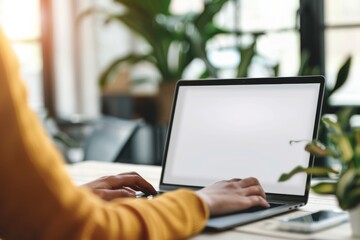 Close up of women hands and laptop with white screen Mock up of computer monitor, Copy space