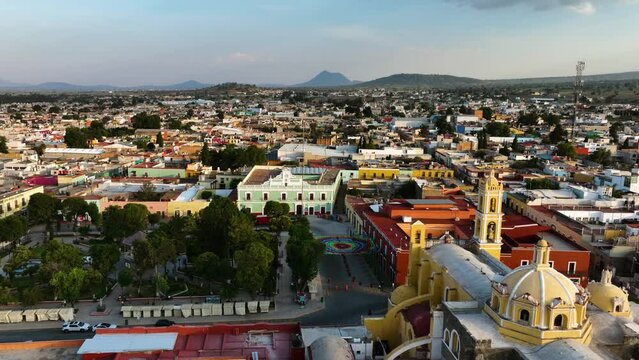 Aerial view backwards over the Parque Ju&aacute;rez and the San Luis Obispo Baroque, sunset in Huamantla, Mexico
