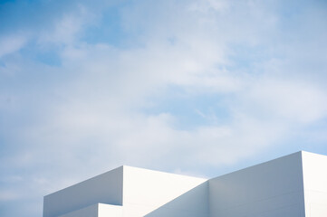 architecture and landscape concept with white building with cloudy sky background