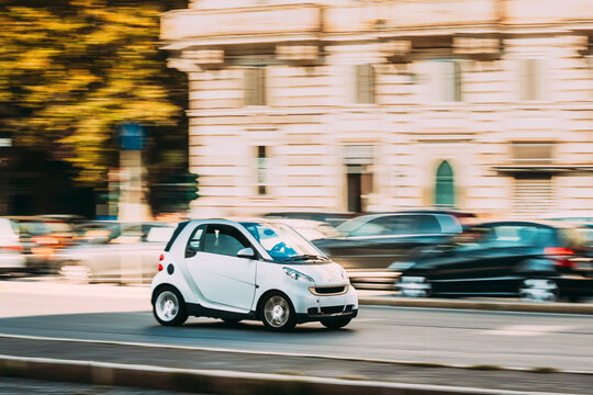 Rome, Italy - October 21, 2018: White Color Smart Fortwo Car Of Second Generation W451 Moving At Street.