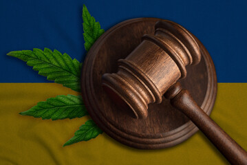 Judges gavel and cannabis leaf on the flag of Ukraine. Legalization of marijuana in Ukraine