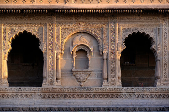 Maheshwar, Madhya Pradesh, INDIA - February 24, 2024, Exterior View of the scenic tourist landmark Maheshwar fort (Ahilya Fort) and temple. This monument is on the banks of the Narmada River.