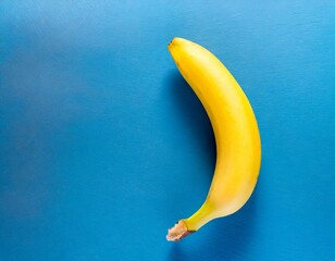 A single pic banana on blue background top view