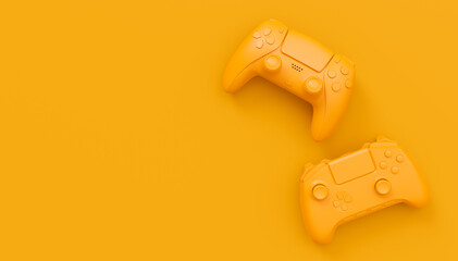 Video game joysticks or gamepads in plain monochrome yellow color background © Vasyl Onyskiv