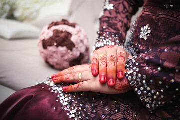 Henna wedding design. Mehndi tattoo. Bride hands with henna tattoos