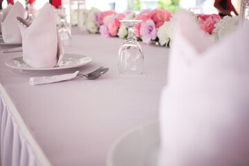 Table set for wedding or another catered event lunch. Wedding catering decor. Selective focus.