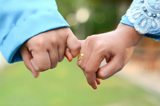 Young married couple holding hands, ceremony wedding day. Wedding Couple Nice Hands.