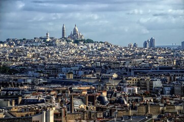 Typical Paris architecture and Basilique Sacre-Coeur on Montmartre Hill, the highest point of Paris, France - obrazy, fototapety, plakaty