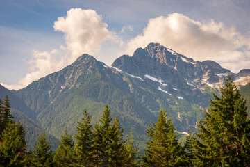 Obraz premium View of the Snow Covered Mountain Peaks and Forest at North Cascades National Park in Washington State