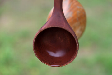 View of the wooden ladle for drinking water in the Buddhist temple