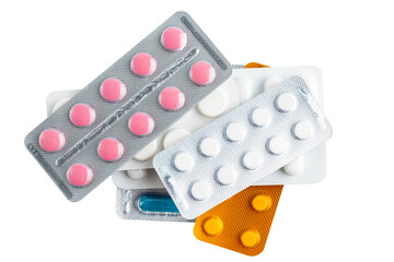 Various medicine capsules, pills and tablets in a blister pack isolated on white background, healthcare and medicine concept, top view