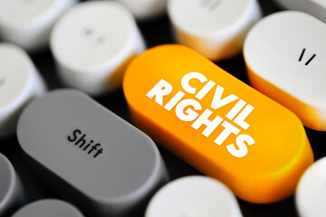 Civil Rights - guarantees of equal social opportunities and equal protection under the law, regardless of race or religion, text concept button on keyboard - obrazy, fototapety, plakaty
