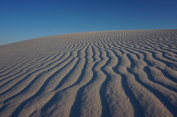 Fototapeta na wymiar White Sands National Park waves in the sand
