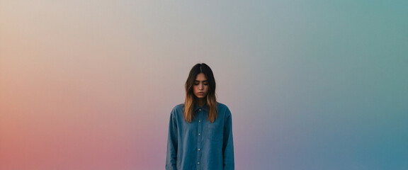 A young woman with a sad expression against a soft gradient background