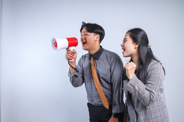 Portrait of Two Young Business Worker Make Announcement to The Side. Businessman Shouting Using...