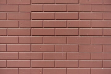 Backdrop - reddish brown painted brick veneer wall
