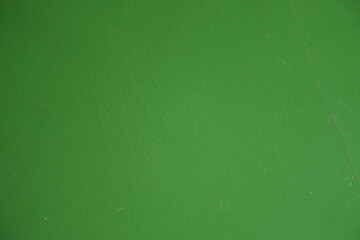 Macro of bright forest green painted wall