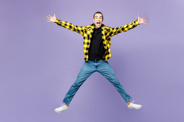 Fototapeta na wymiar Full body young happy fun cool middle eastern man wear yellow shirt casual clothes jump high with outstretched hands isolated on plain pastel light purple background studio portrait Lifestyle concept