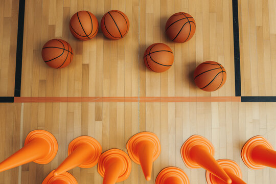 Basketball Training Equipment. Balls and Training Cones on Wooden Parquet. Basketball Arena